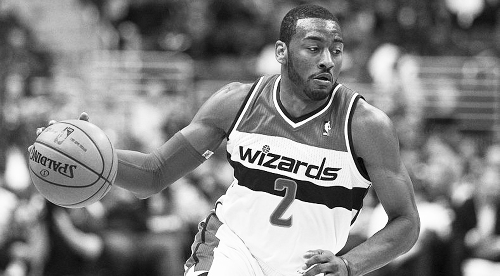 Washington Wizards guard John Wall dribbles down the court. Wall was chosen to the 2014 Eastern Conference All-Star roster as a first-time selection. Writers Durst and Janick also chose him for their Eastern All-Star roster. | Courtesy of Wikimedia Commons/Keith Allison.