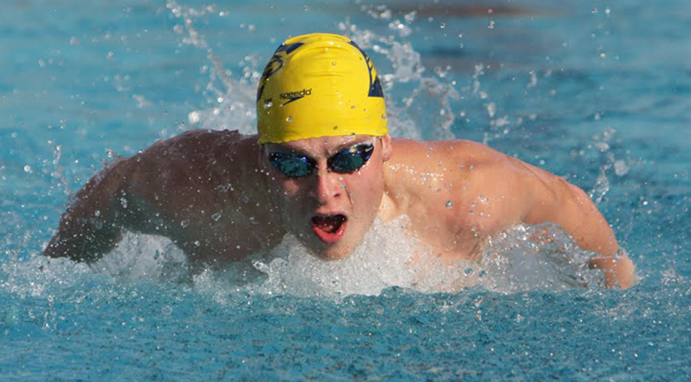 Junior John Galvin swims in the butterfly event at the Emory Invitational. Galvin added two NCAA ‘B’ cut times, helping the Emory Eagles win the invite against Birmingham Southern College (Ala.). The Eagles now are preparing for the NCAA Championships.  | Courtesy of Emory Athletics.