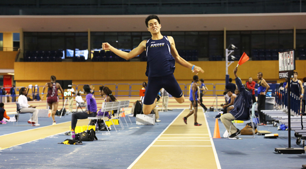 Freshman Charlie Hu leaps into the air during the Samford Invitational long jump competition at the Birmingham Crossplex in Alabama. This past weekend, the track and field team split, some traveling to Alabama and others traveling to Tennessee to compete in the Tiger Indoor Invitational.  | Courtesy of Emory Athletics