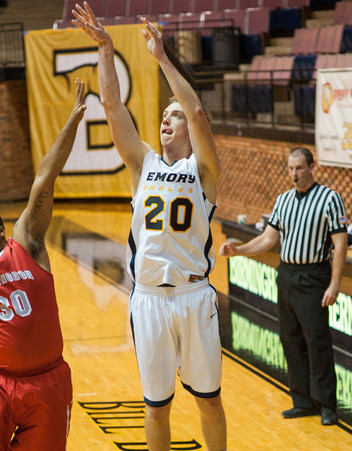 Senior guard Alex Foster shoots from behind the arc. Foster and the Eagles will play New York University and Brandeis University (Mass.) again this weekend at home. | Courtesy of Emory Athletics.