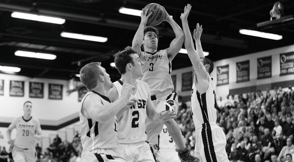 Senior captain Mike Florin goes for a basket against the University of Wisonsin-Stevens Point. Florin and the Eagles ended their season with a 73-53 loss.  | Courtesy of Emory Athletics