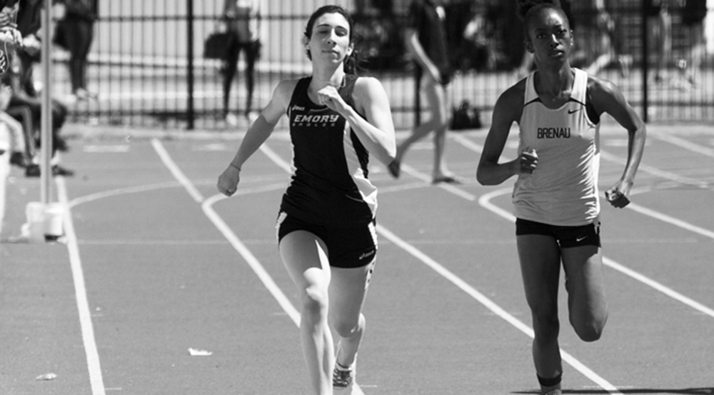 Freshman Erica Goldman runs next to her opponent. Goldman recorded a career-best time of 57.82 seconds in the 400-meter dash this past weekend.  | Courtesy of Emory Athletics