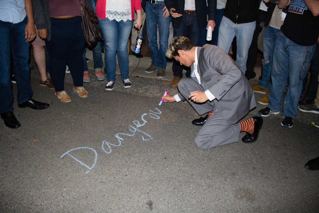 Milo Yiannopoulos chalks "Dangerous Faggot xox" in Asbury Circle on Wednesday night. / Julia Munslow, Executive Editor