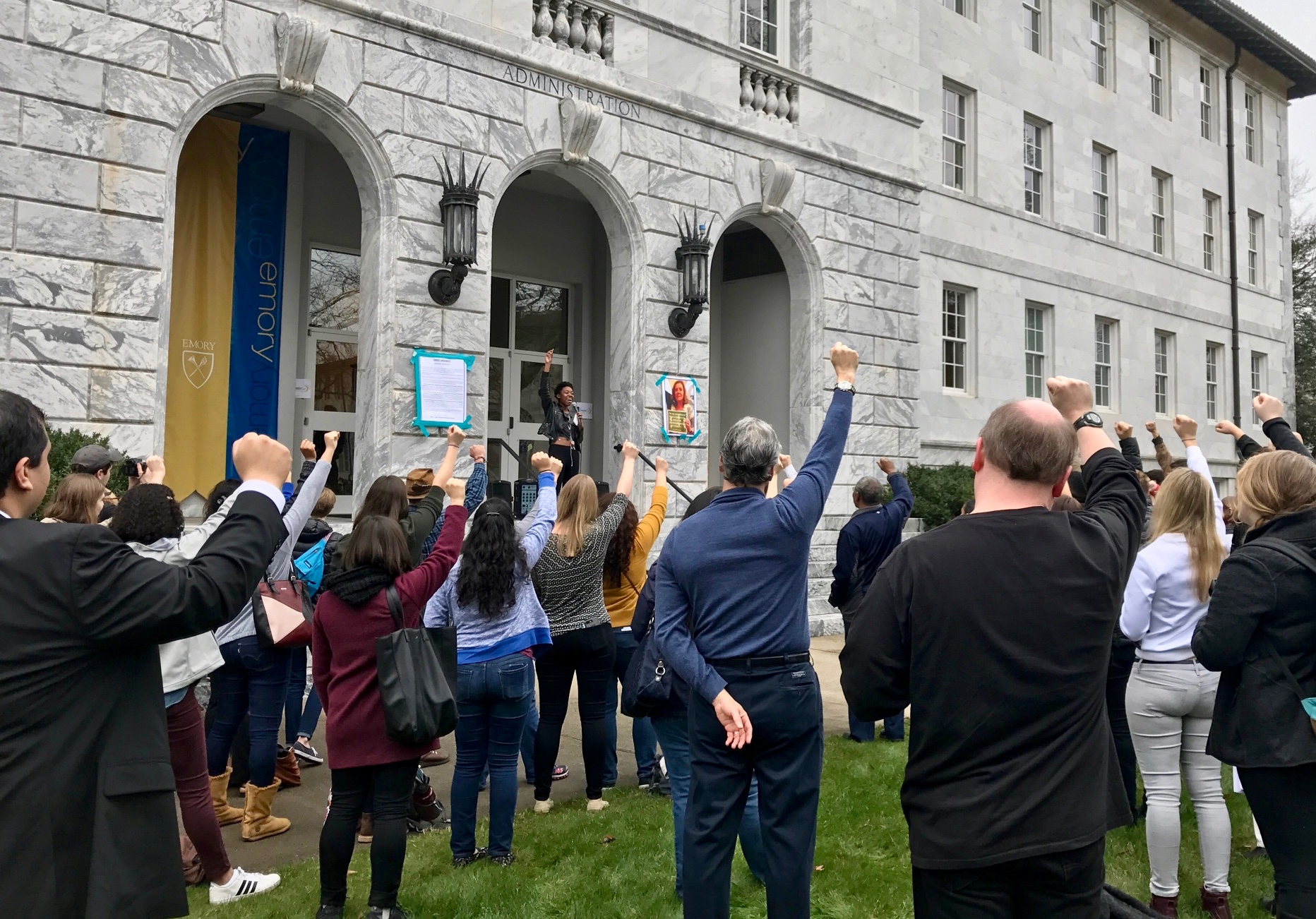 Demonstrators raise their fists in unison, chanting "We must love one another and protect each other. We have nothing to lose but our chains.” / Julia Munslow, Executive Editor 
