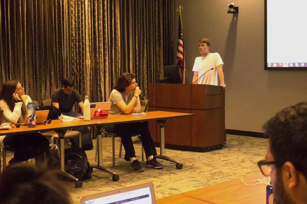 College-wide Representative and College junior Will Palmer (RIGHT) presents to the Student Government Association about the undergraduate government restructure Monday. / Michelle Lou, News Editor
