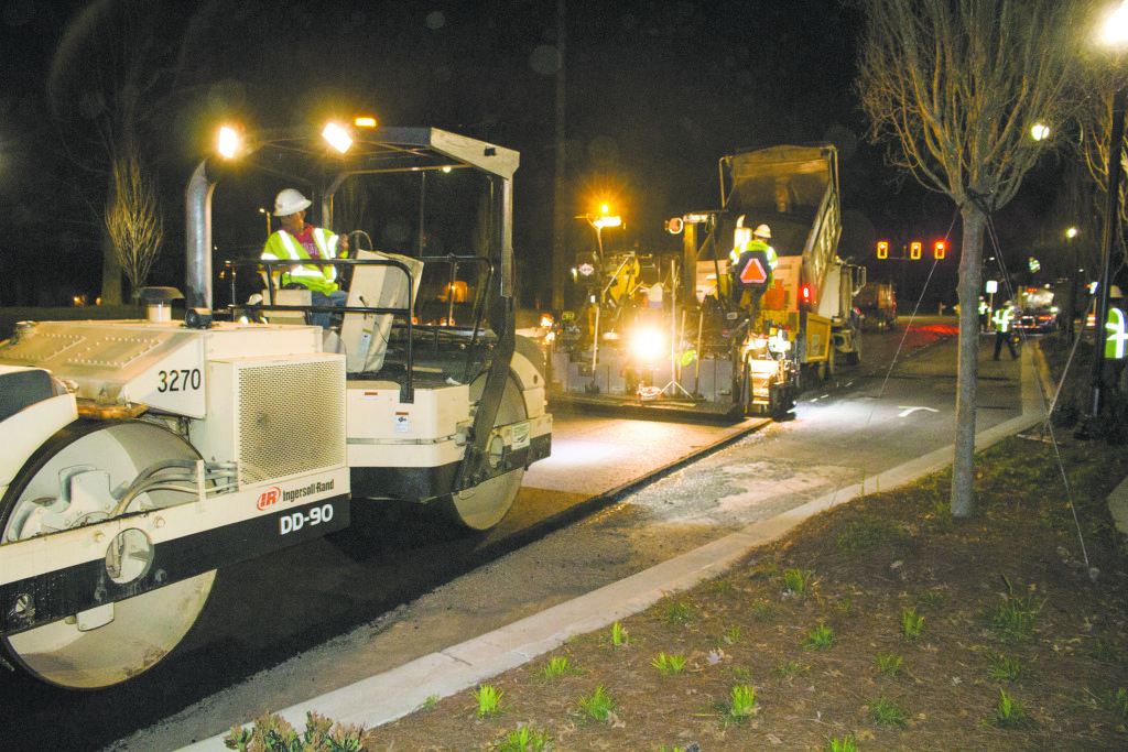Construction workers pave the road on Clifton Road./Richard Chess, Asst. News Editor/City