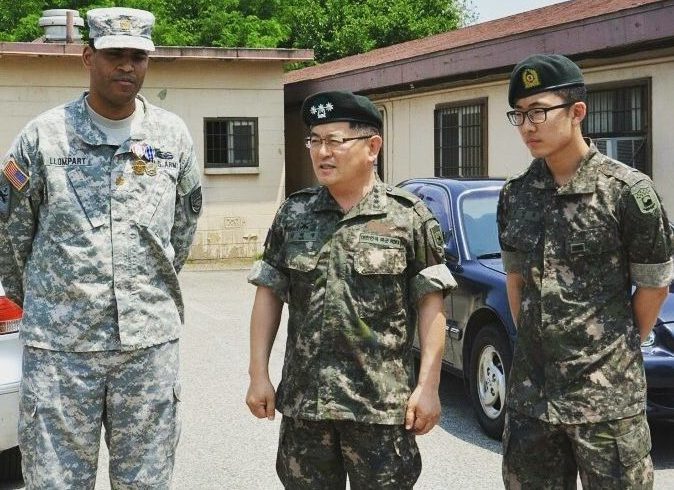 Minho Cho (19B) (Far Right) translates for American and South Korean military officials during his two years of required military service as a South Korean citizen. Courtesy of Minho Cho